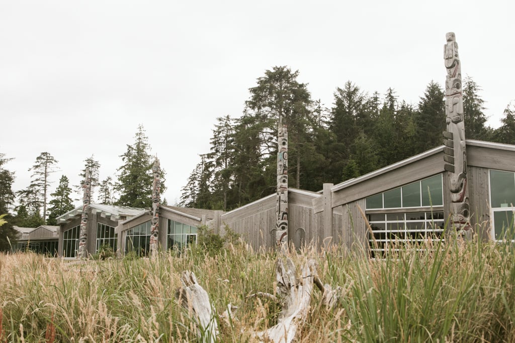 The Haida Heritage Centre is nestled amongst tall grass.