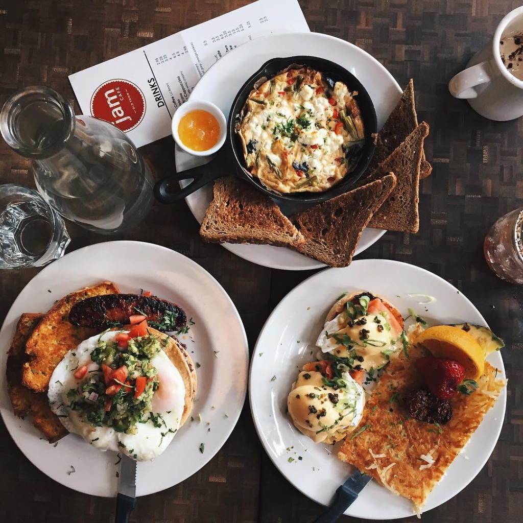 Three carefully plated breakfast dishes, including eggs benedict, a frittata, and huevos rancheros