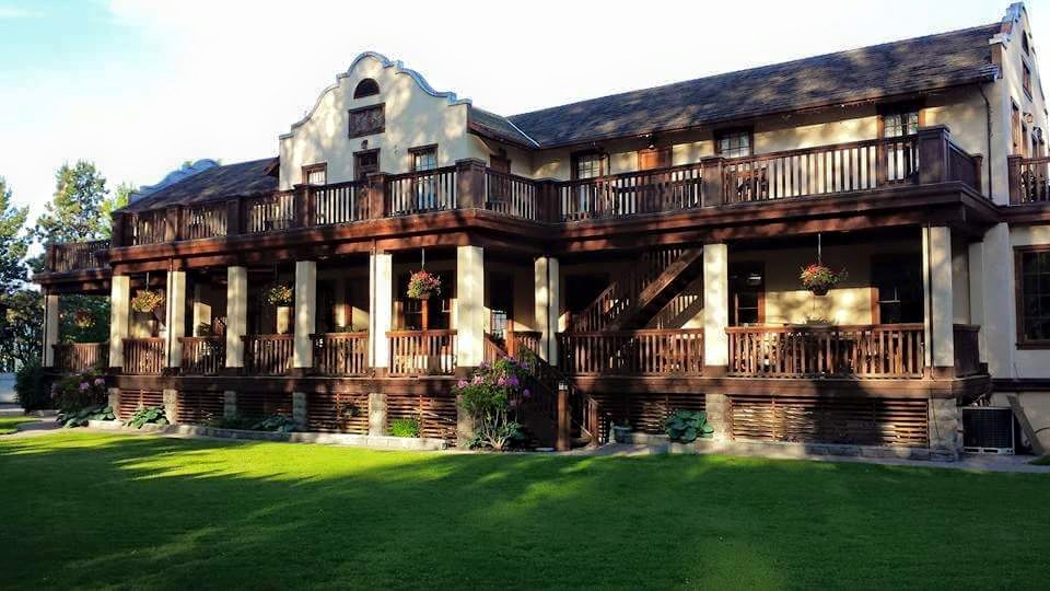 A sprawling heritage inn with wrap around balconies.