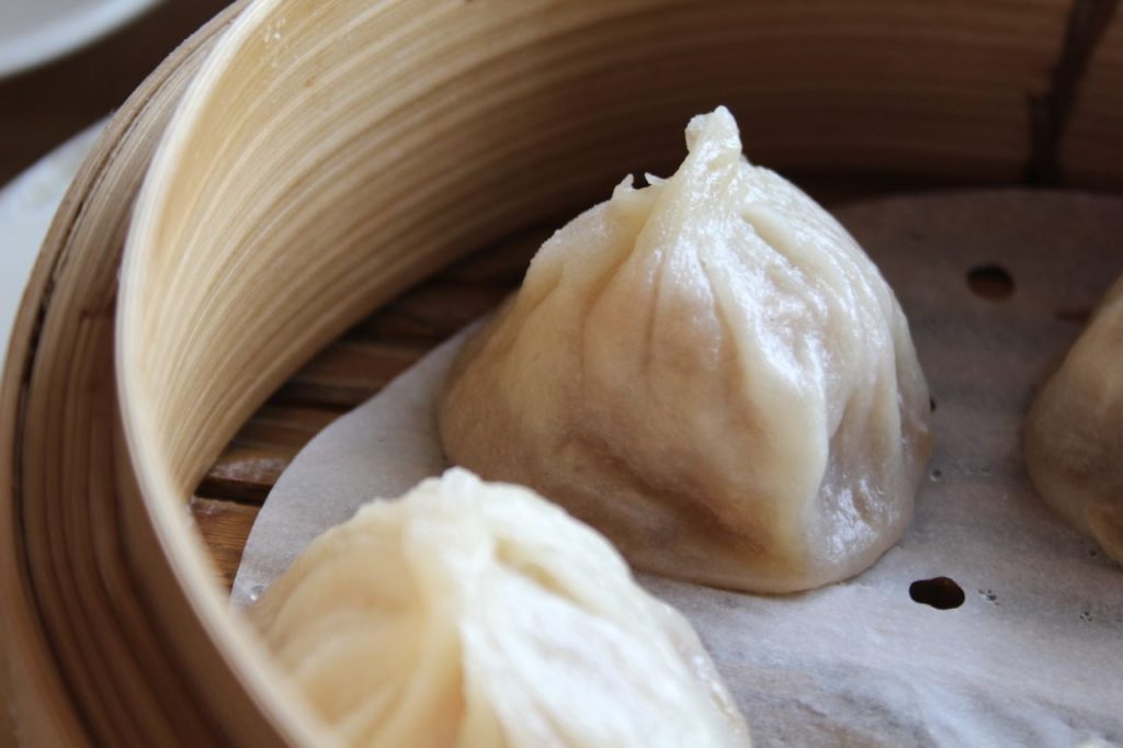 A dish of Xiao long bao dumplings.