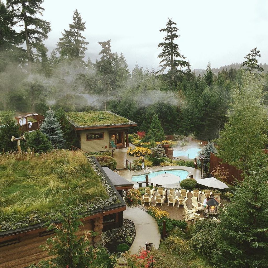 Outdoor mineral pools emit steam at Scandinave Spa, Whistler.