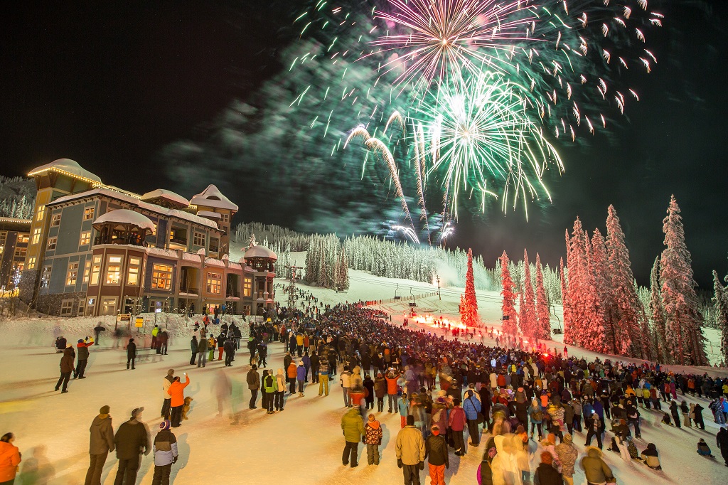 Colourful fireworks explode over a quaint skiing village.