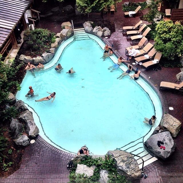 Vacationers lounging in the pool at Harrison Hot Springs Resort. 