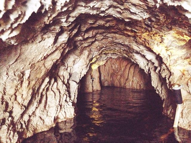 A dark water-filled cave.