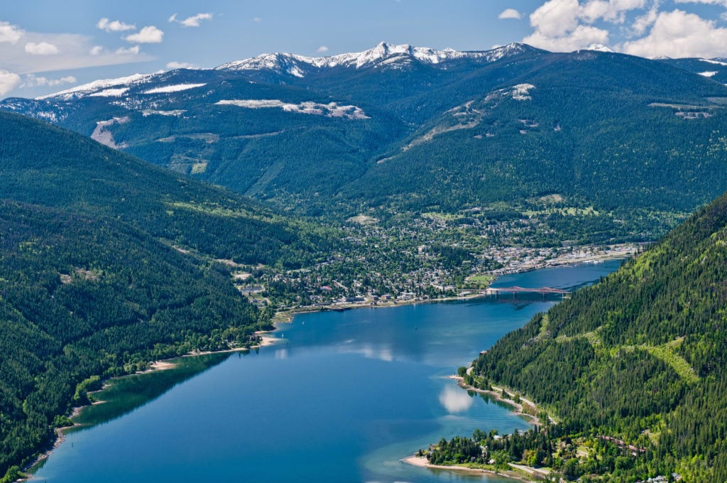 Aerial view of Kootenay Lake, nestled in a mountainous landscape.