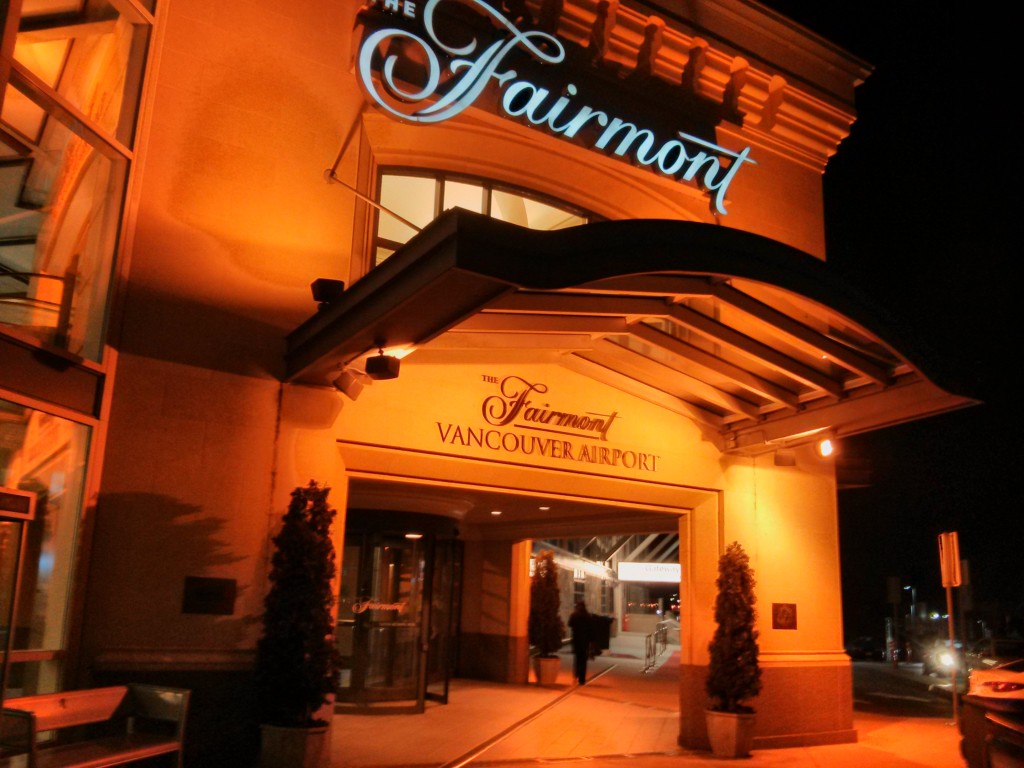 Exterior of the Fairmont Vancouver Airport Hotel at night.