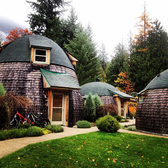 Eco-friendly dome accommodations under an overcast sky.