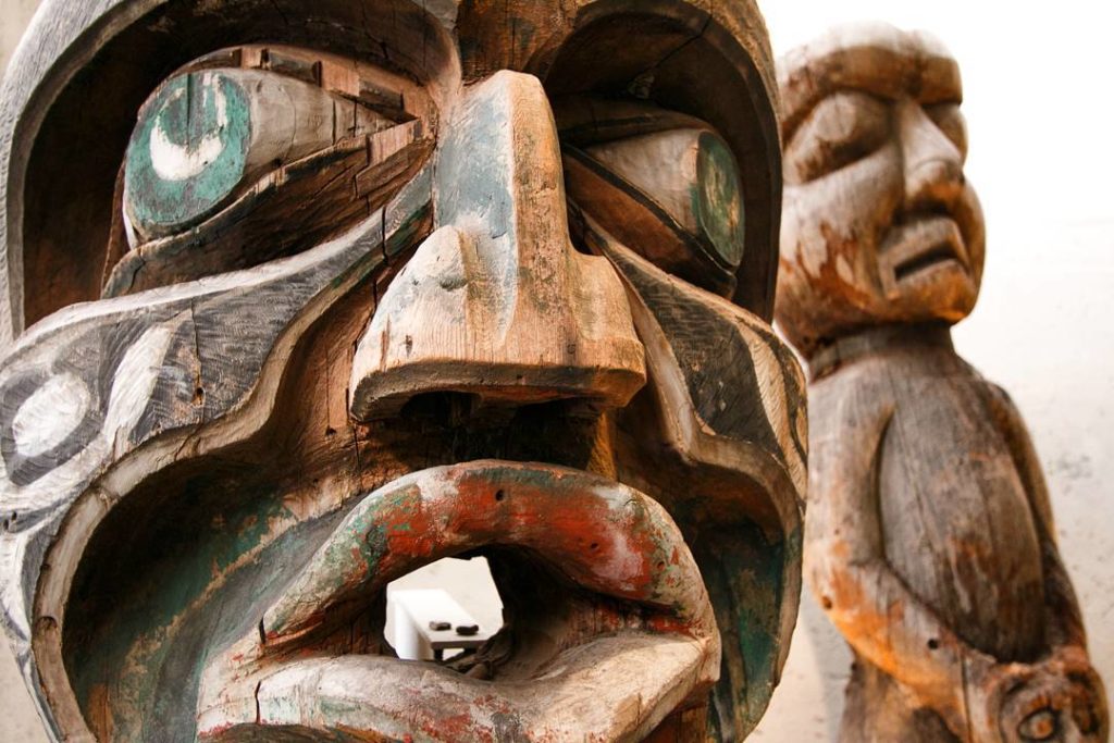 Weathered First Nations totems.