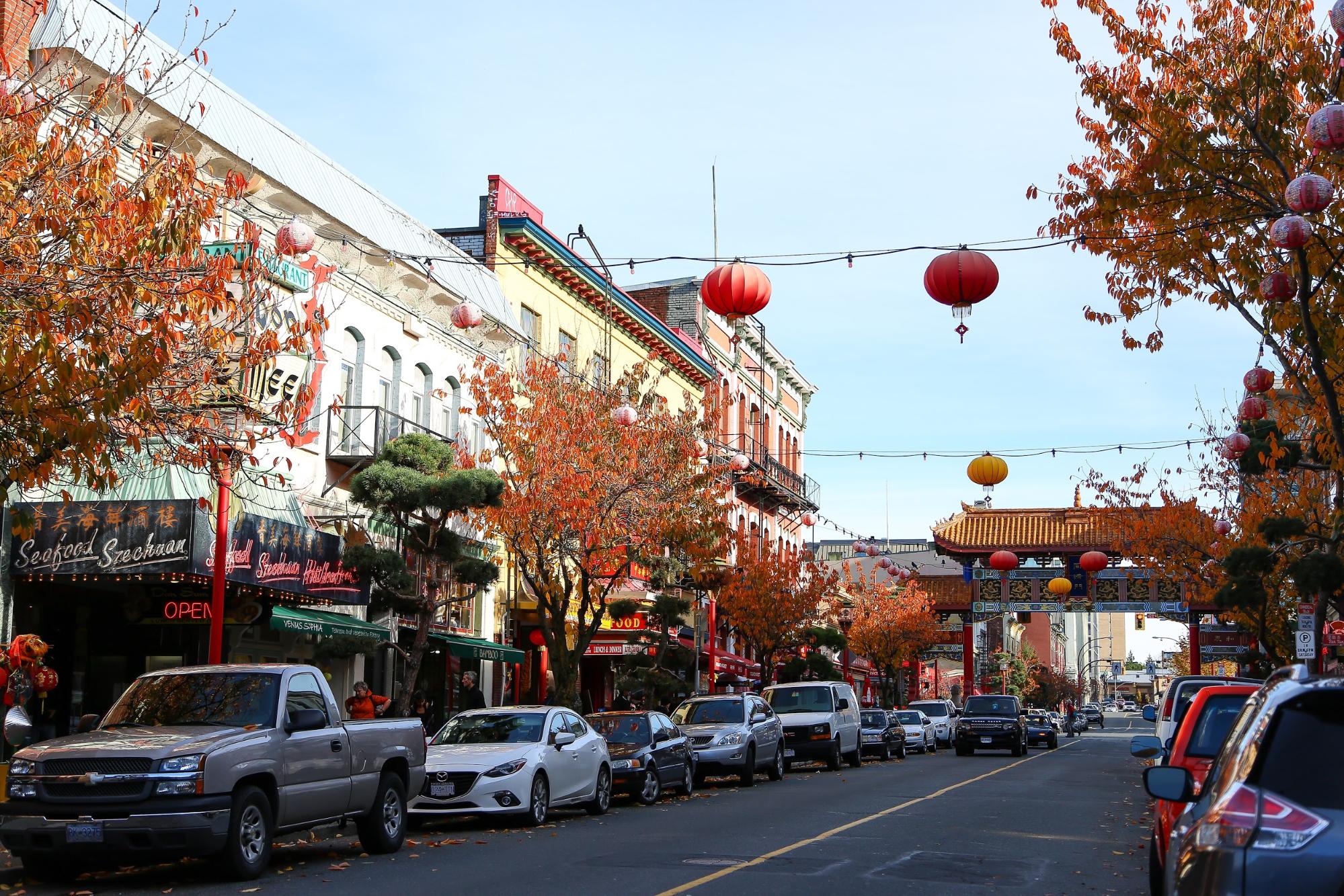 Colourful Chinese lantern strung across a city street.