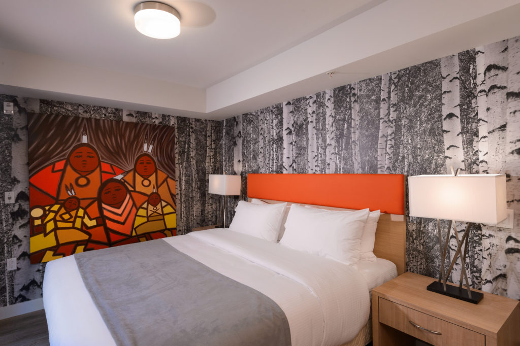 A luxurious suite in Vancouver’s Skwachàys Lodge, complete with aboriginal artwork and a king size bed.
