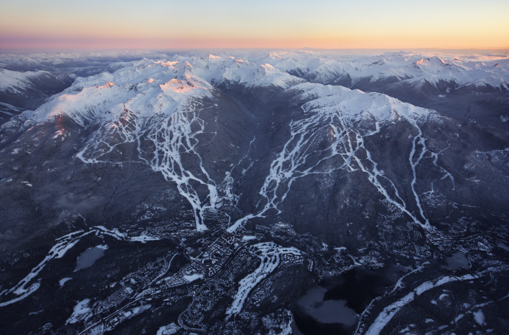 An aerial view of a snow capped mountain range.