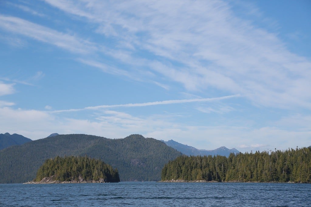 Two small islands with Vancouver Island in the background.