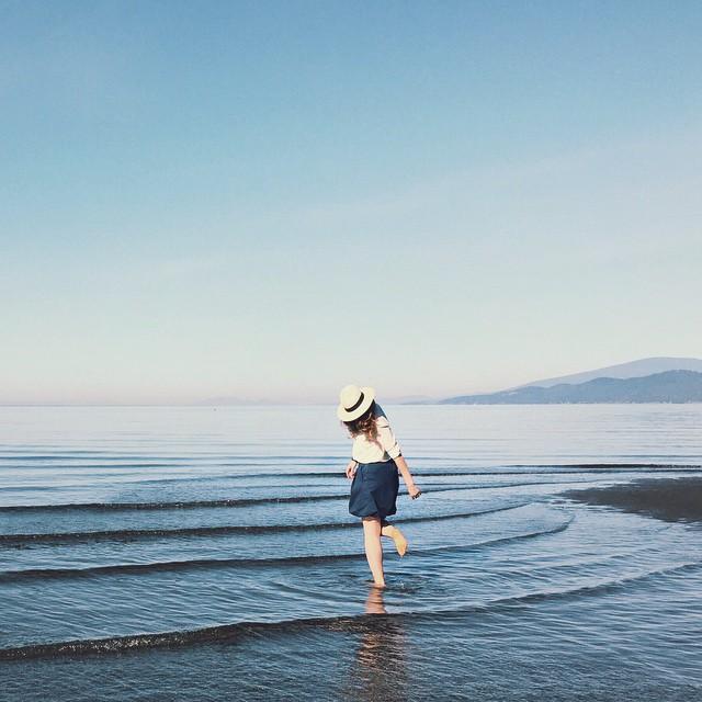 Wading in the waters at Wreck Beach in Vancouver. Photo: @racheycakes via Instagram