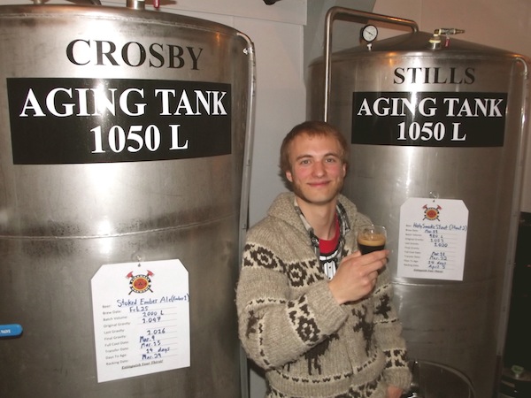 Firehall Brewery's Sid Ruhland with some musically themed tanks in his brewery.