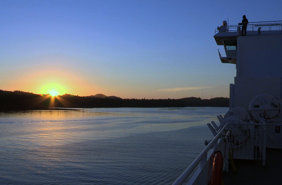The sun sets over a BC Ferry.