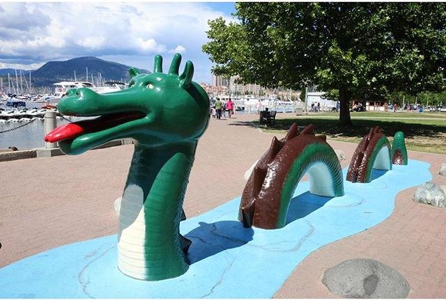 Statue of an Ogopogo on a pier.