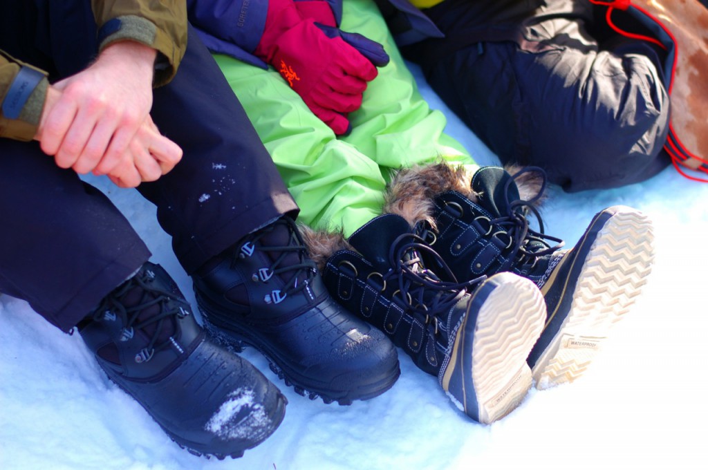 Two people's boots in the snow