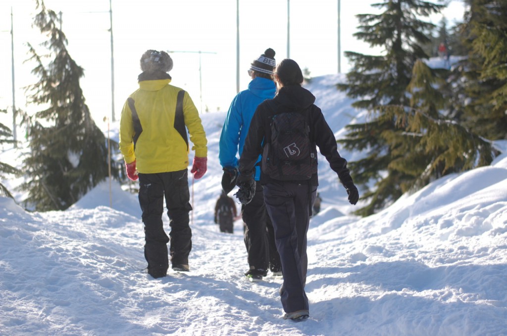 Three people walking in the snow