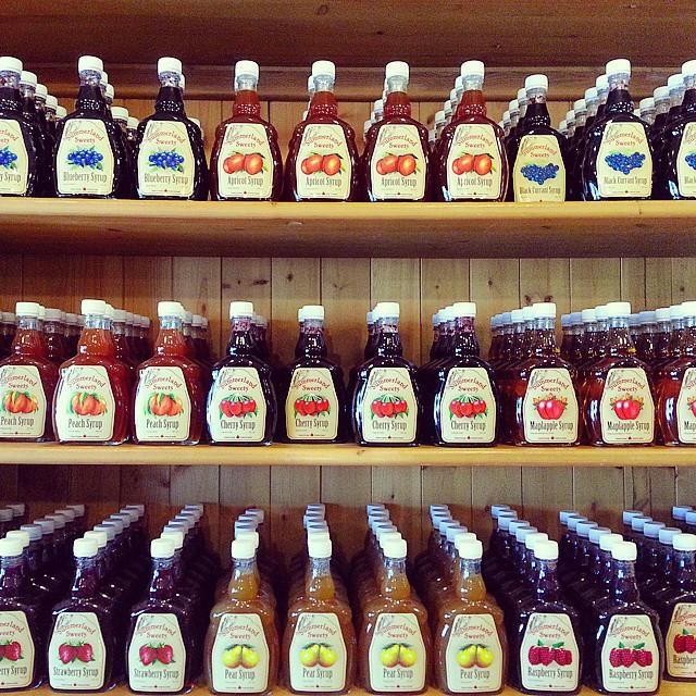 Shelves filled with different flavours of fruit syrups.