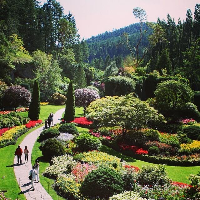 People walk along the path at the Butchart Gardens