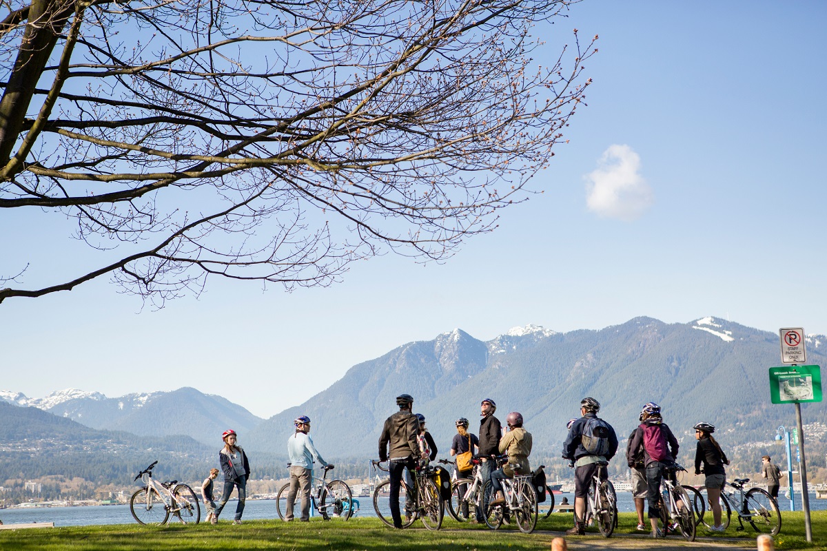 Cycling in Vancouver with North Shore Mountains in the backdrop |