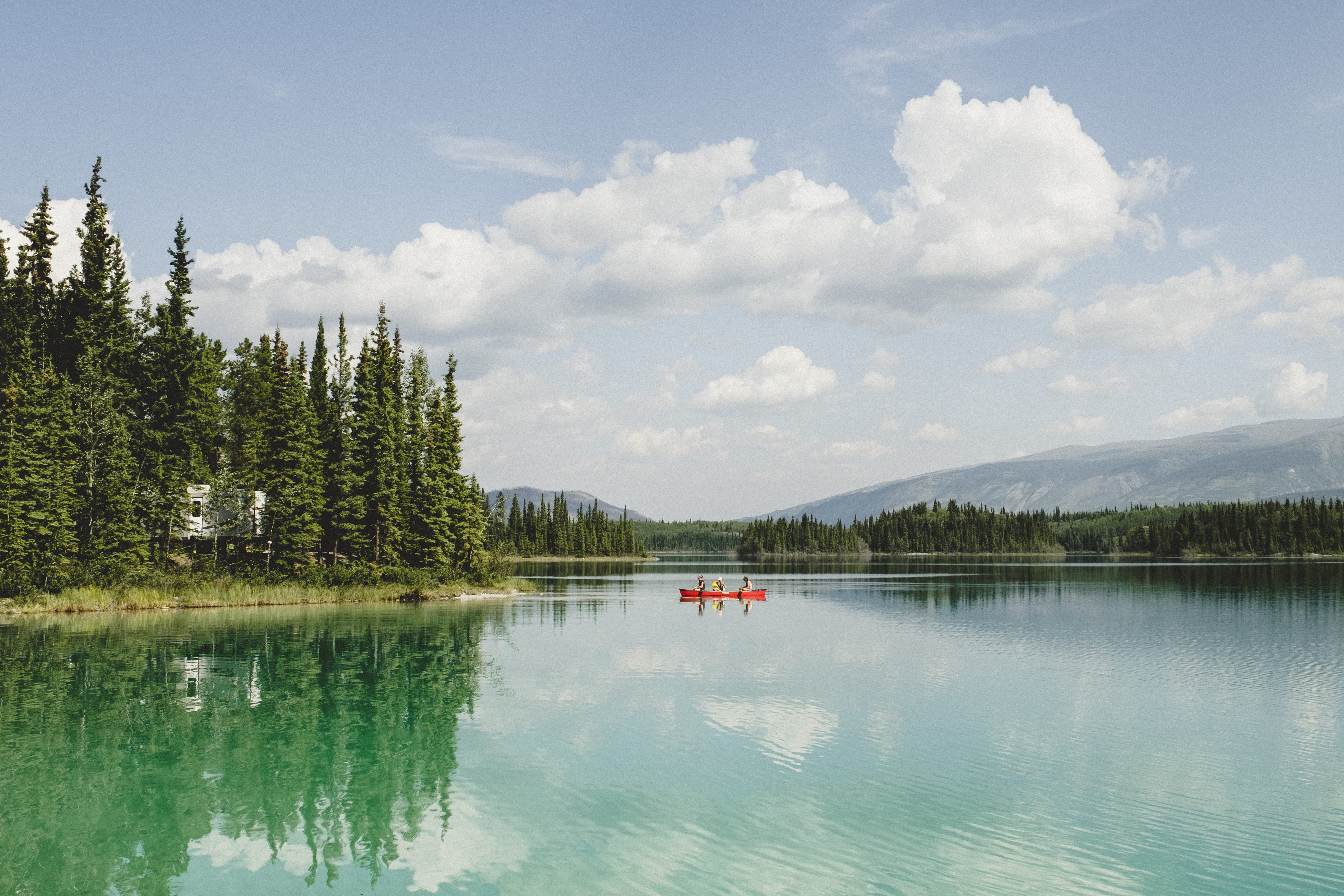 Two people canoeing on a lake in British Columbia