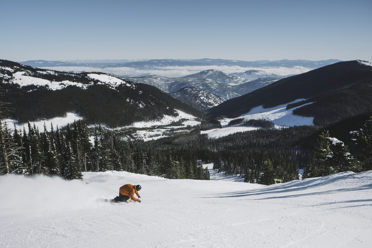 man skiing down mountain trail at Apex Mountain Resort