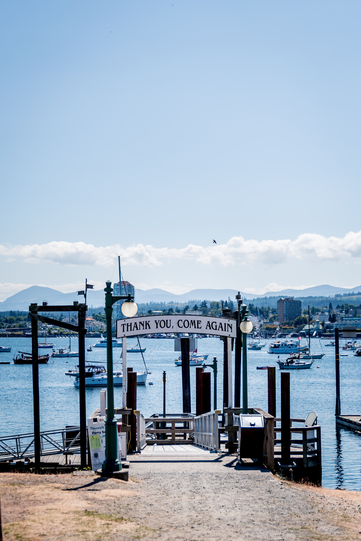 Pier at the harbour with a walkway down to the boat ramp. The words, 