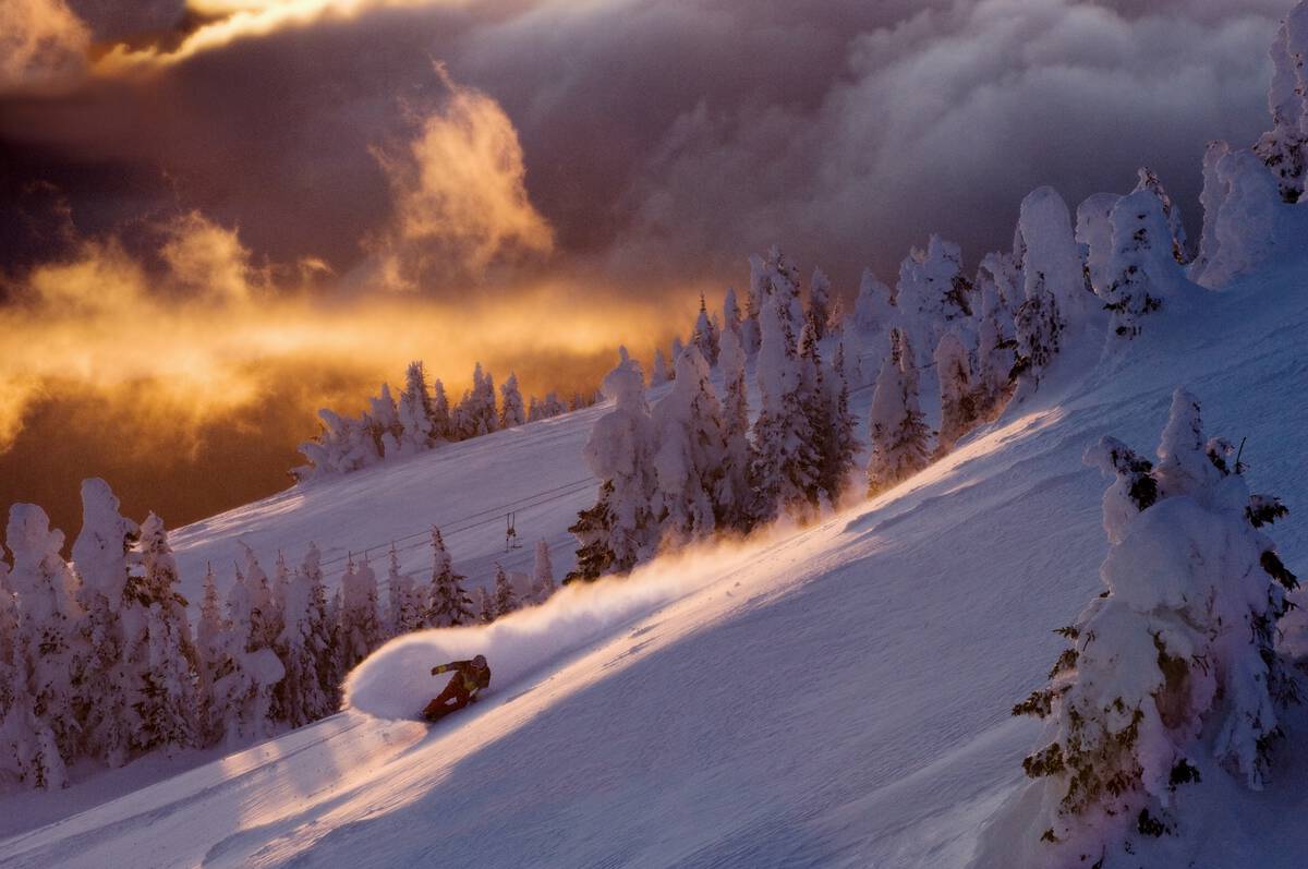 a sunset snowboard session at sun peaks resort, british columbia, canada