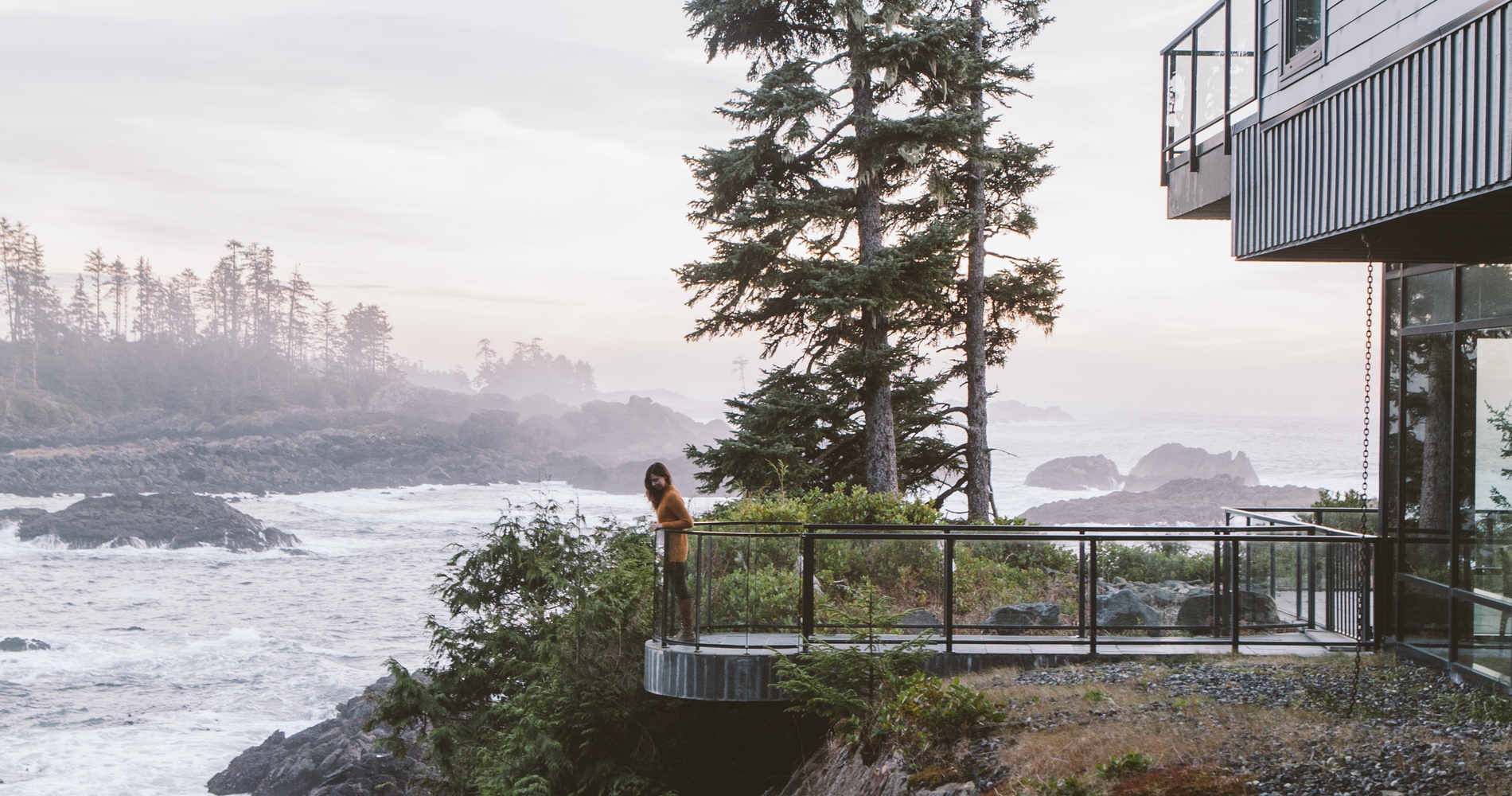 A person stands on the deck of the Black Rock Oceanfront Resort in Ucluelet