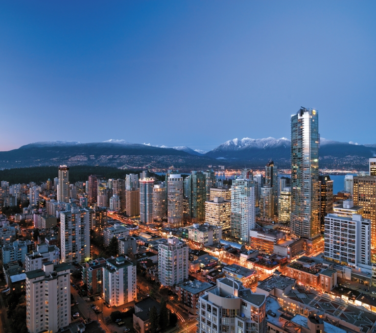Evening view of skyline with snow on mountains | Destination Vancouver/Shangri-La Hotel