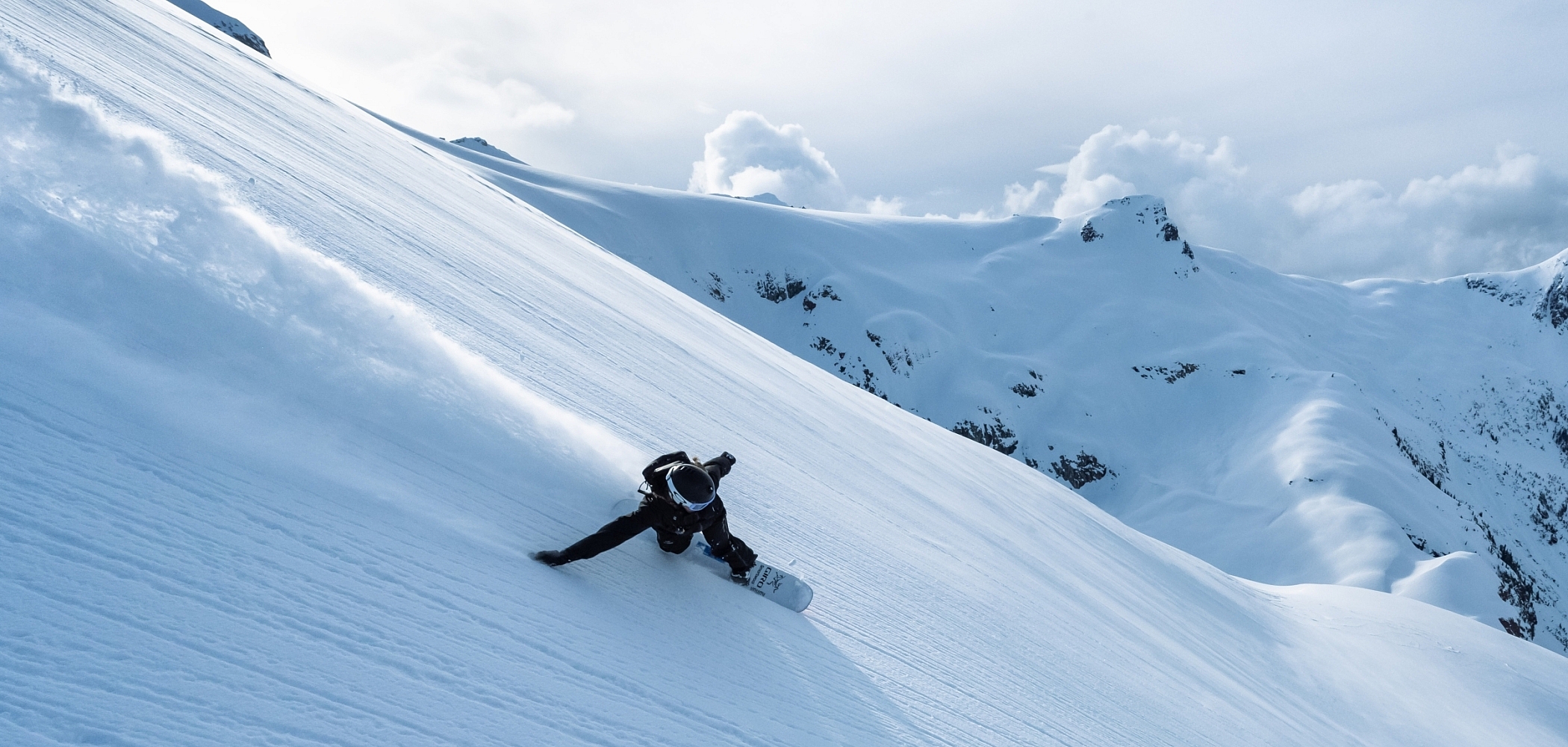 A snowboarder on a mountain in British Columbia