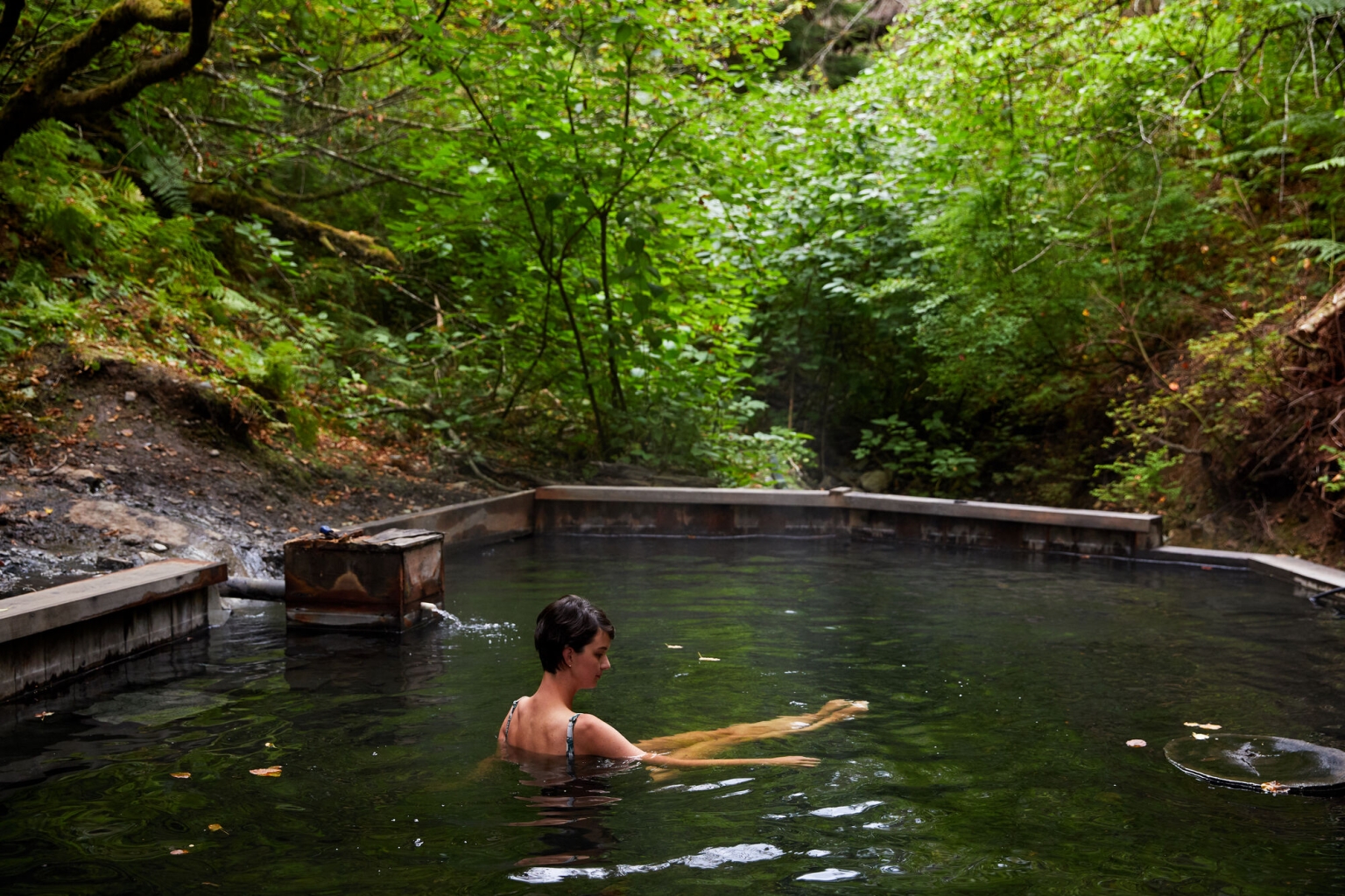 A person soaks in the tub at the Aiyansh Hot Springs in the Nass Valley.