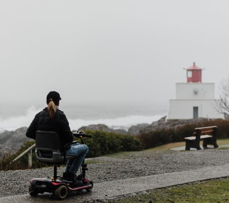 Woman in a wheelchair on the Wild Pacific Trail in Ucluelet | Lexa Bergen
